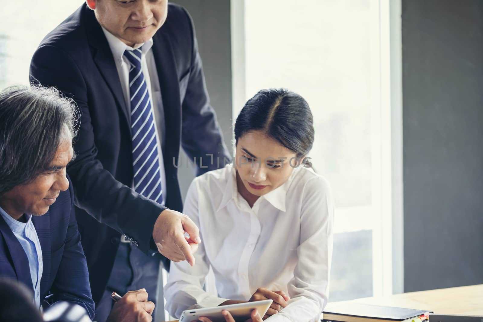 Image of business people hands working with papers at meeting. Businessman holding pens and holding graph paper are meeting to plan sales to meet targets set in next year.