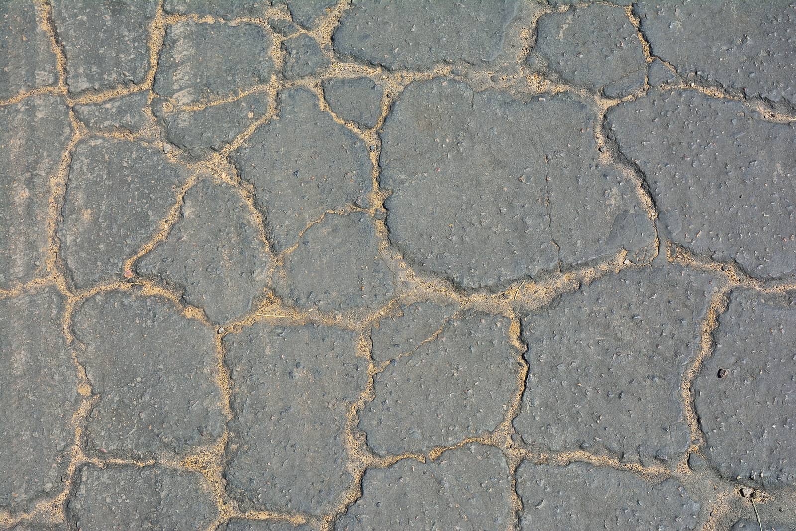 Grey cracked asphalt background. by CreativePhotoSpain