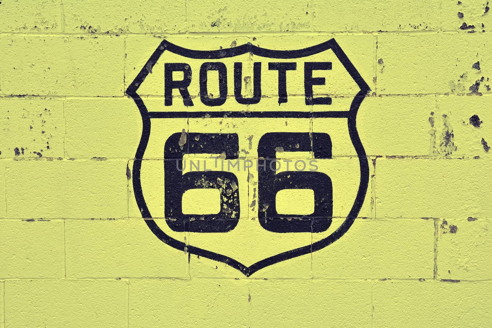 Old Route 66 sign on wall. by CreativePhotoSpain