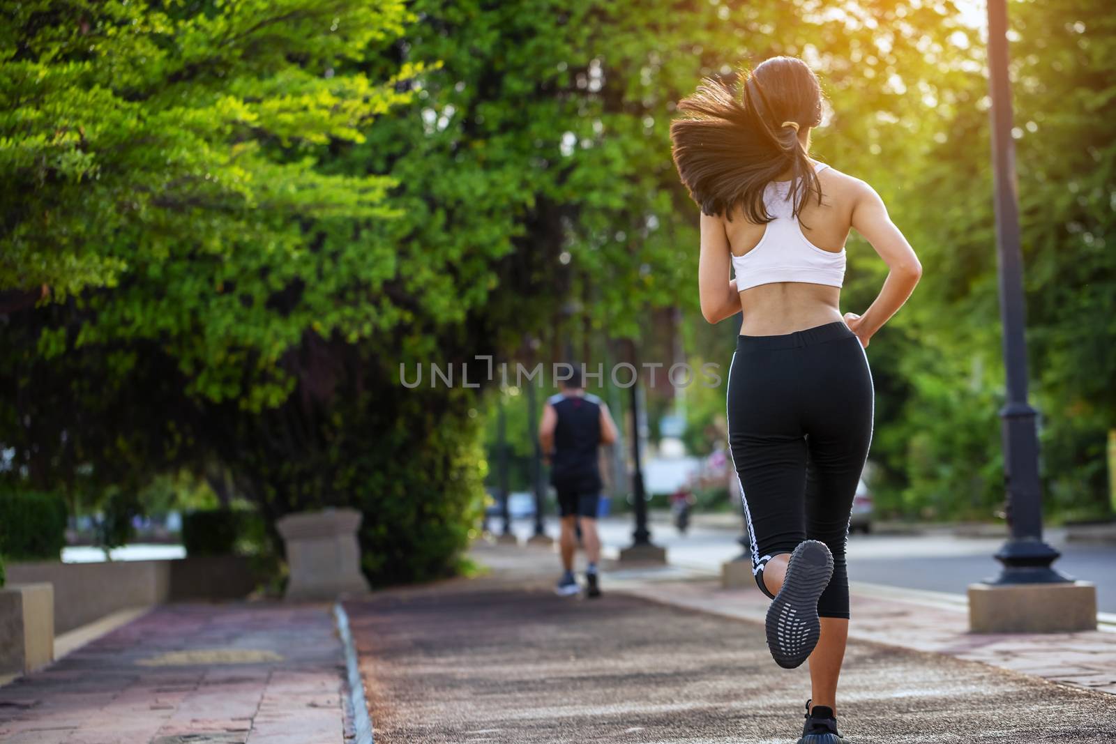 Beautiful woman jogger outdoor living healthy lifestyle in city  by numberone9018