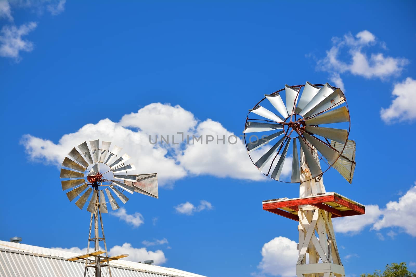 Two windmill on an agricultural farm in USA. by CreativePhotoSpain