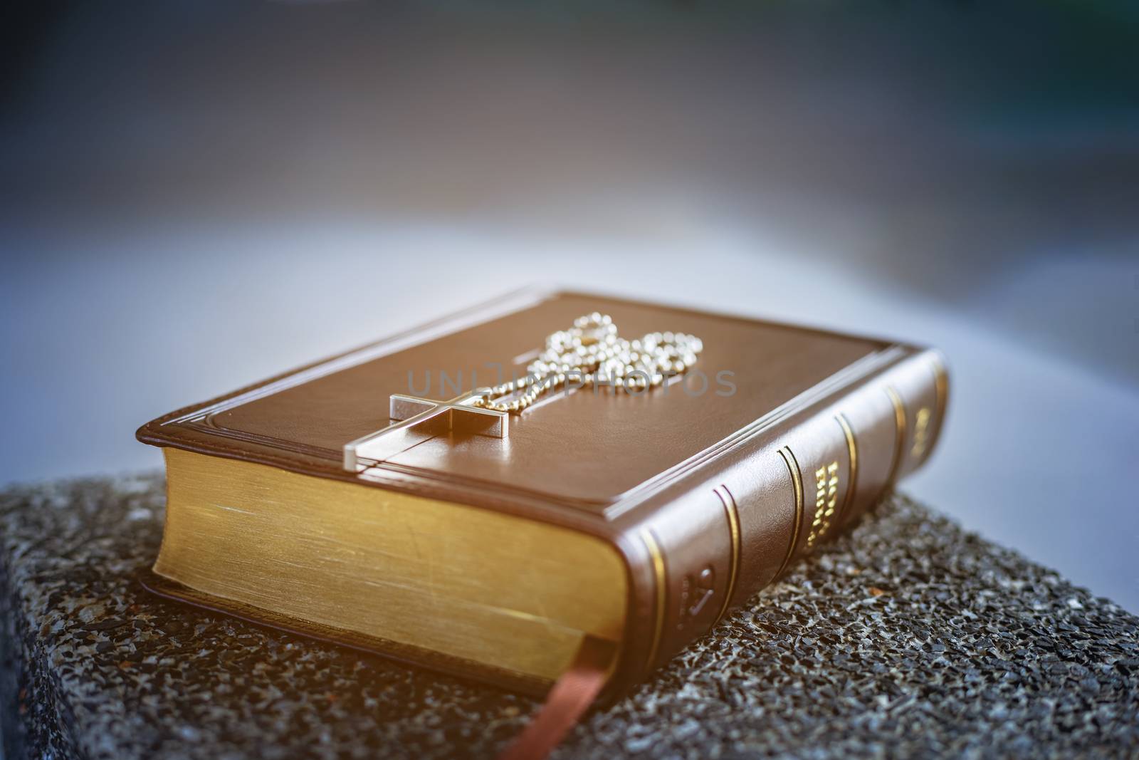 The Holy bible on the black stone floor. Christianity concept. Holy Bible background. 