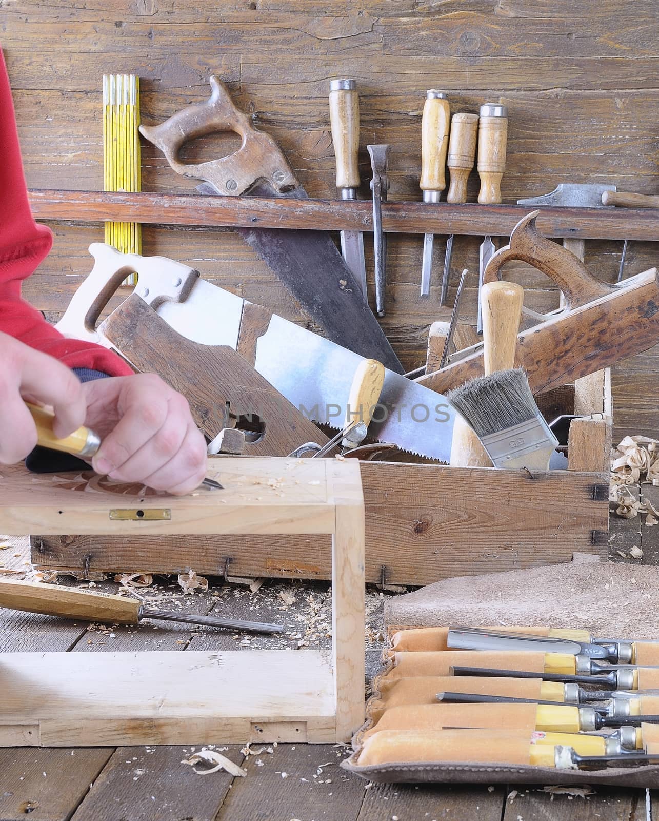 Carpenter working wood on the workbench carpentry.