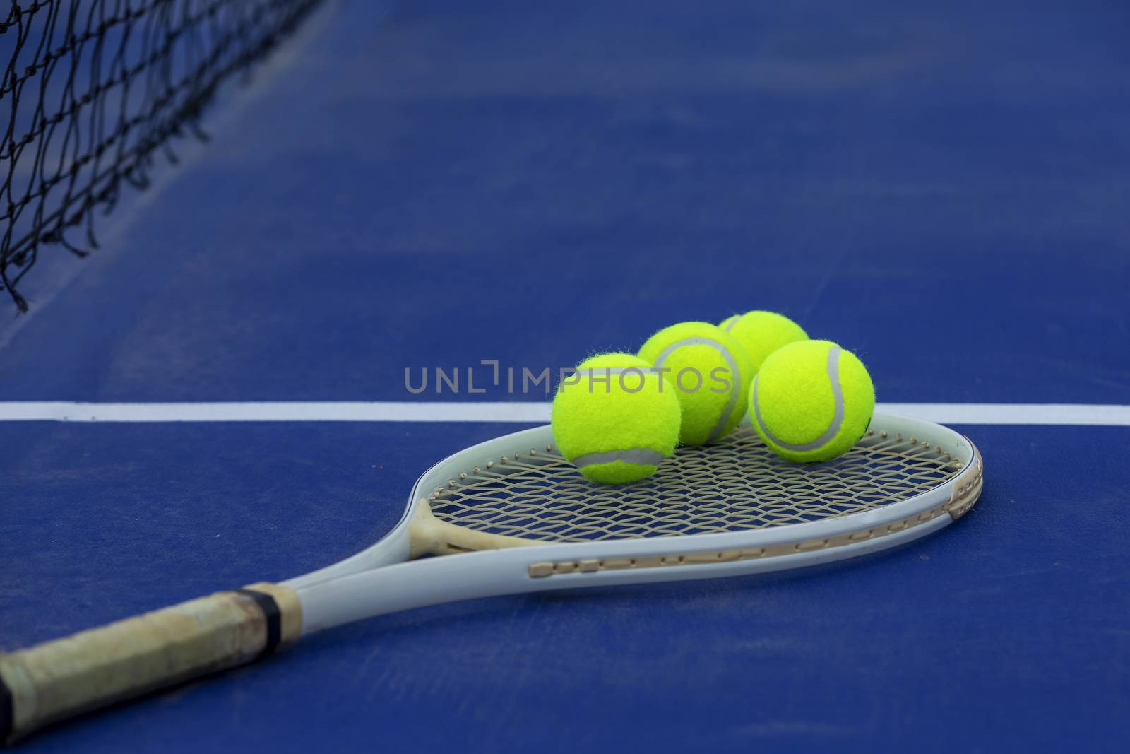 Close-up tennis racket and ball placed on on the blue field by numberone9018