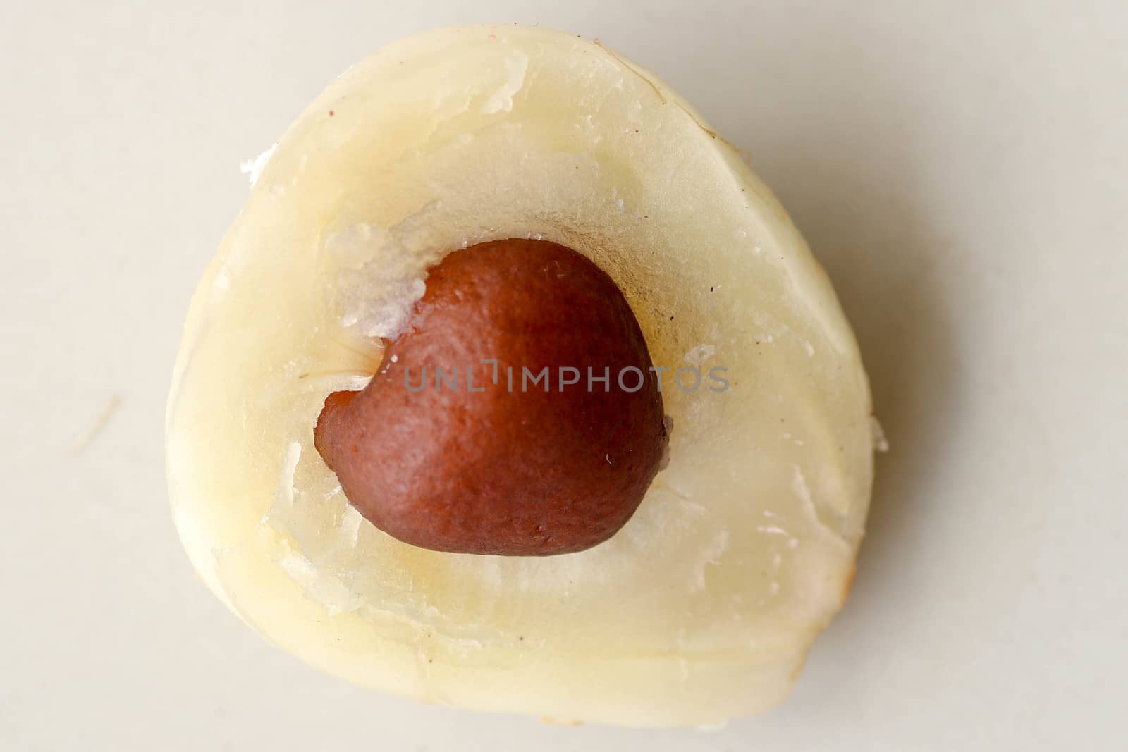 Close up of single piece of Snake fruit with seed. Top view of single healthy fruit. Salak pondoh is one of the salak cultivars that mostly grows in area of Bali. Macro photo of Sweet Salacca.