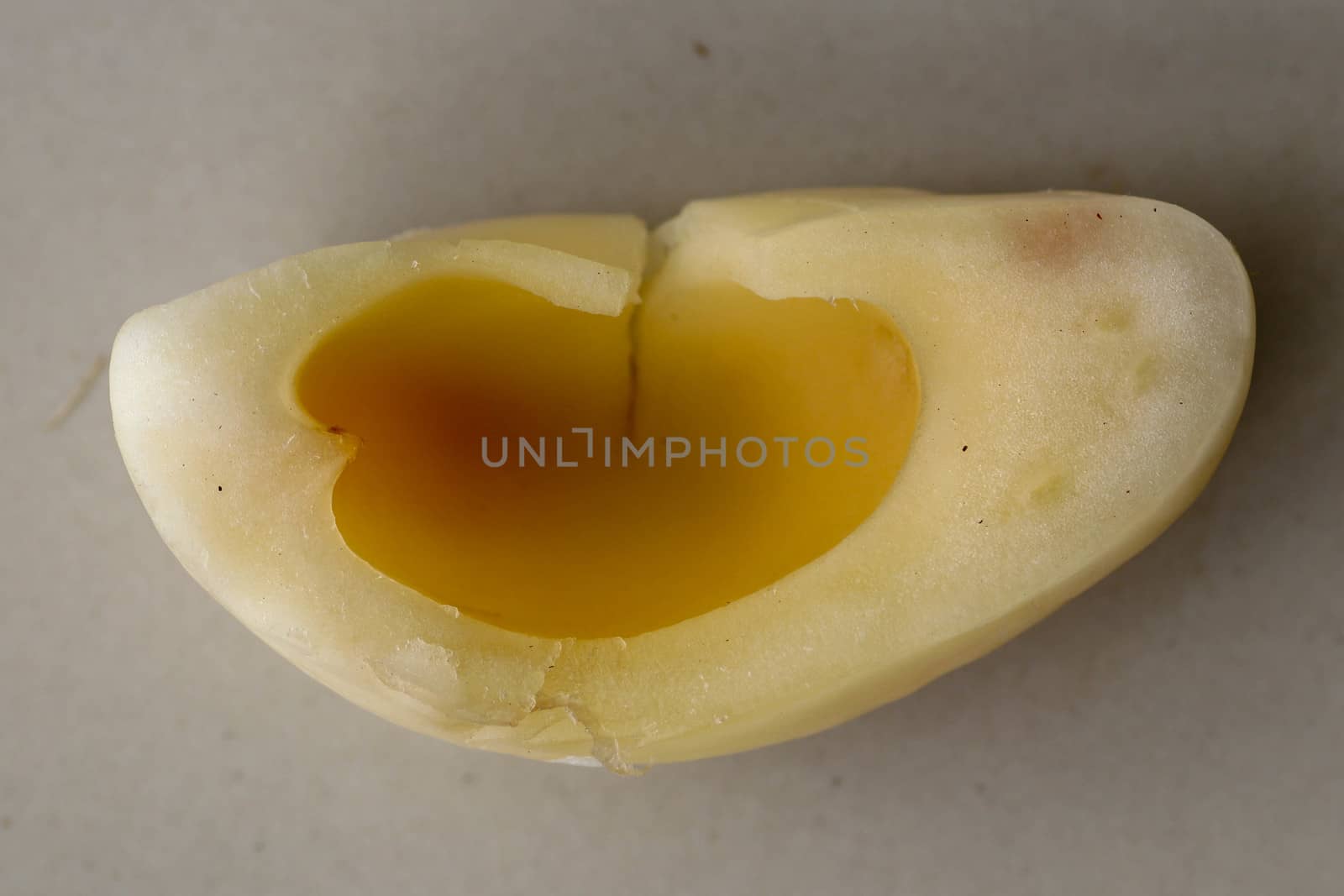 Close up of single piece of Snake fruit. Top view of single healthy fruit. Salak pondoh is one of the salak cultivars that mostly grows in area of Bali. Macro photo of Sweet Salacca zalacca.