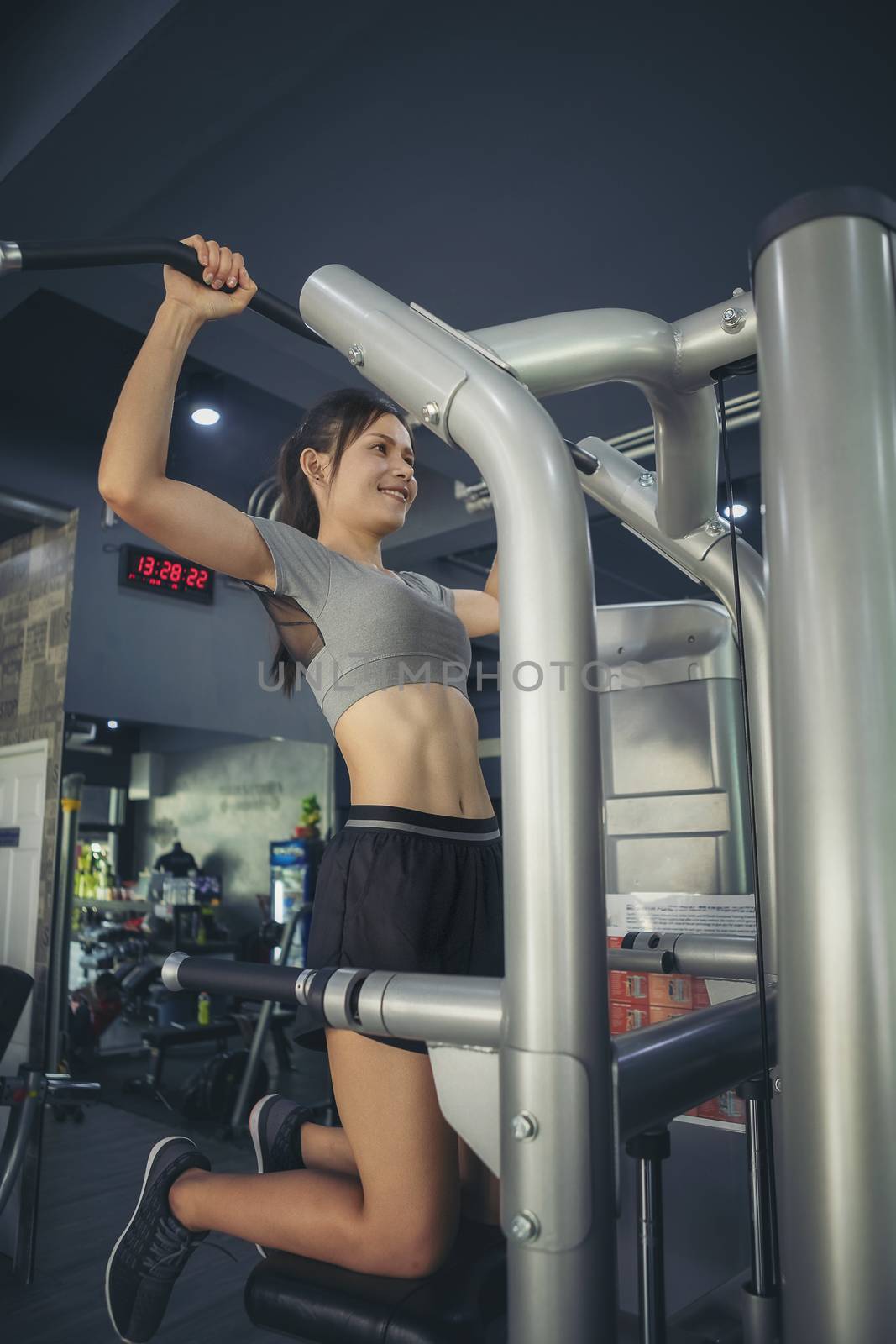 Young sporty man and woman training in modern gym. Gym exercise  by numberone9018