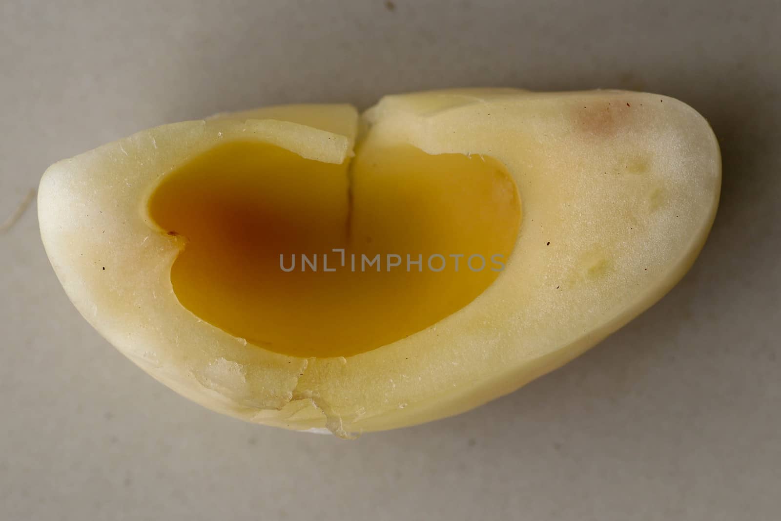 Close up of single piece of Snake fruit. Top view of single healthy fruit. Salak pondoh is one of the salak cultivars that mostly grows in area of Bali. Macro photo of Sweet Salacca zalacca.