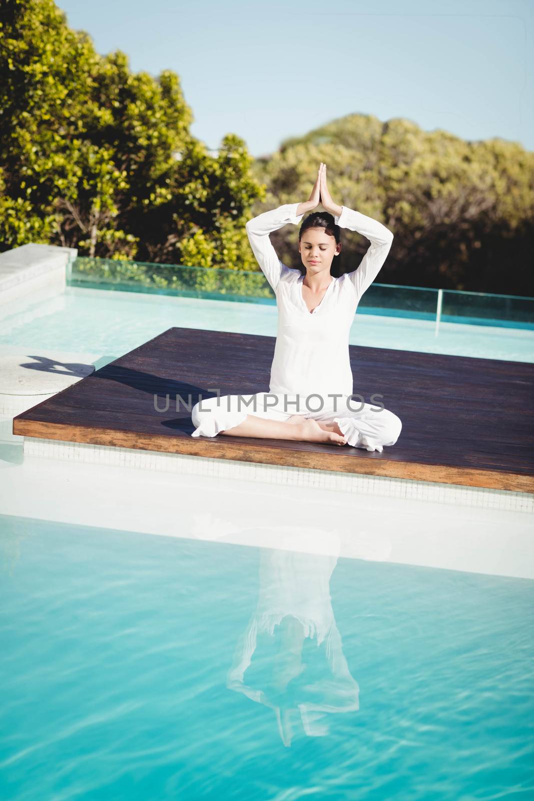 Calm brunette doing yoga by Wavebreakmedia