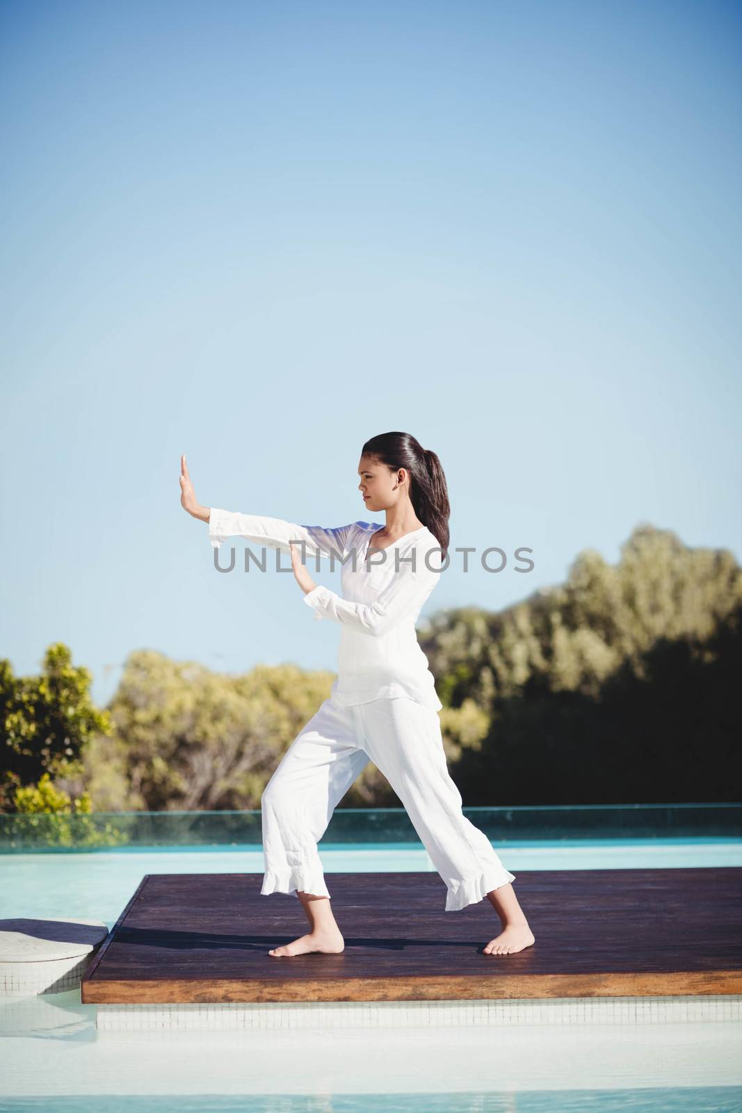 Calm brunette doing yoga by Wavebreakmedia