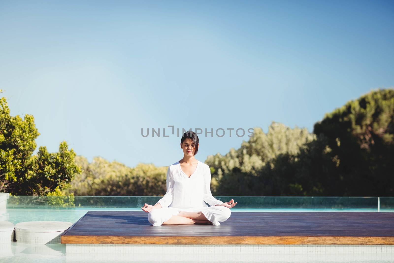 Calm brunette doing yoga by Wavebreakmedia