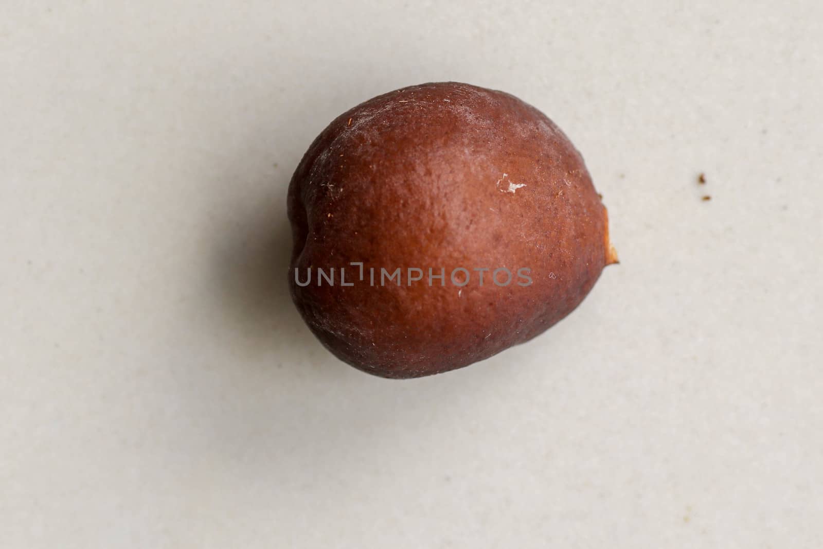 Snake fruit seeds on a white background. Close up of seeds. Salak is a fruit which in Indonesia has almost the same fruit skin as snake skin. The taste of the fruit is delicious.