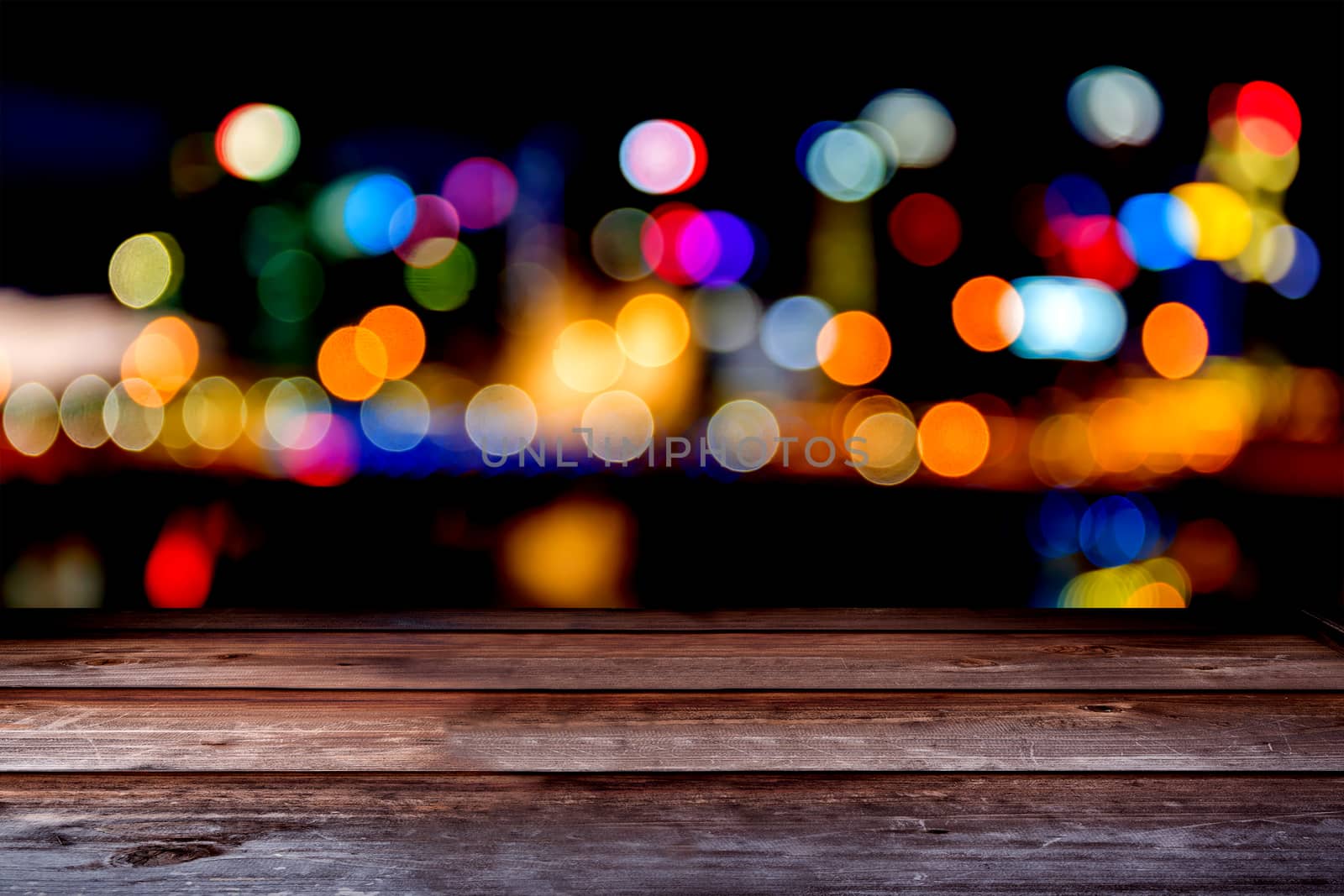 Wood tabletop in perspective view with city bokeh background