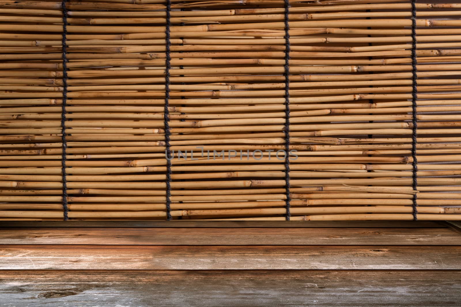 Wood tabletop in perspective view with bamboo curtain retro background