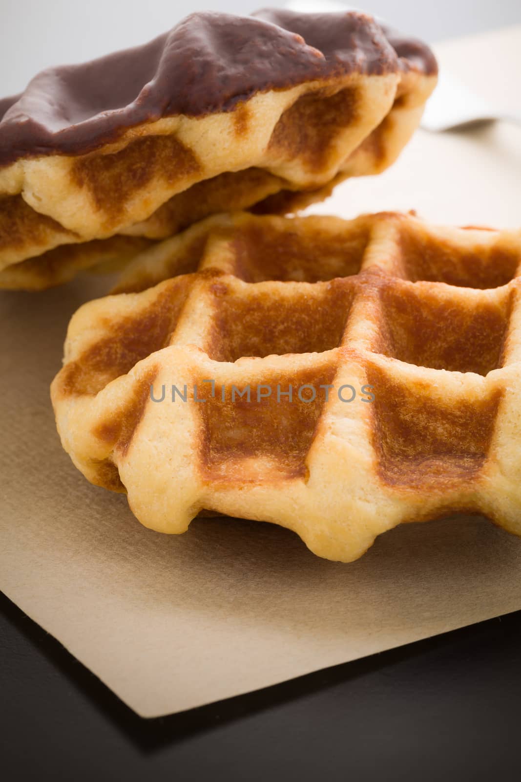 Waffle coated with chocolate as snack for breakfast.