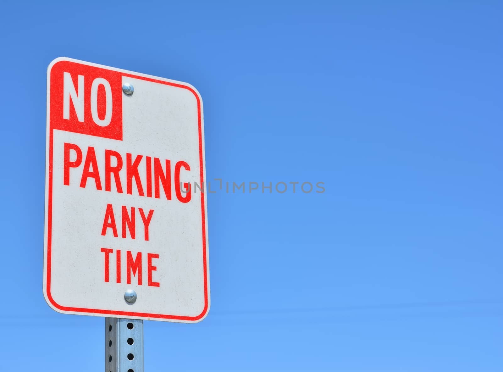 Red and white No Parking Any Time sign