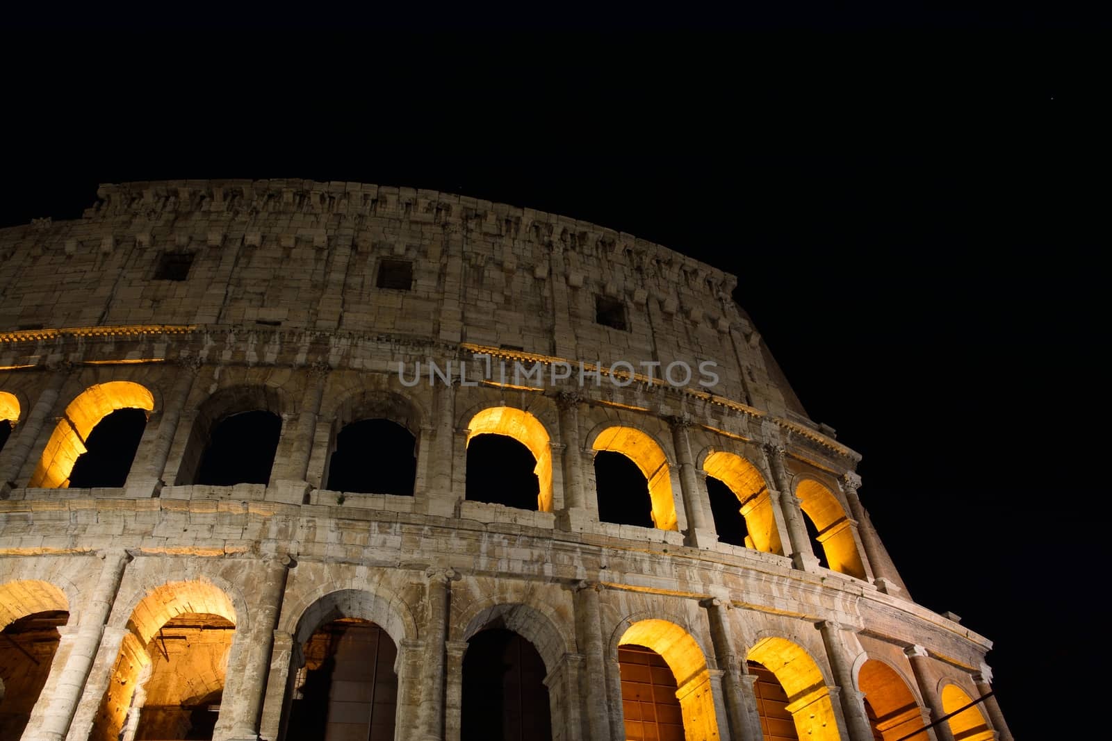 Night view of the Colosseum illuminated in Rome.