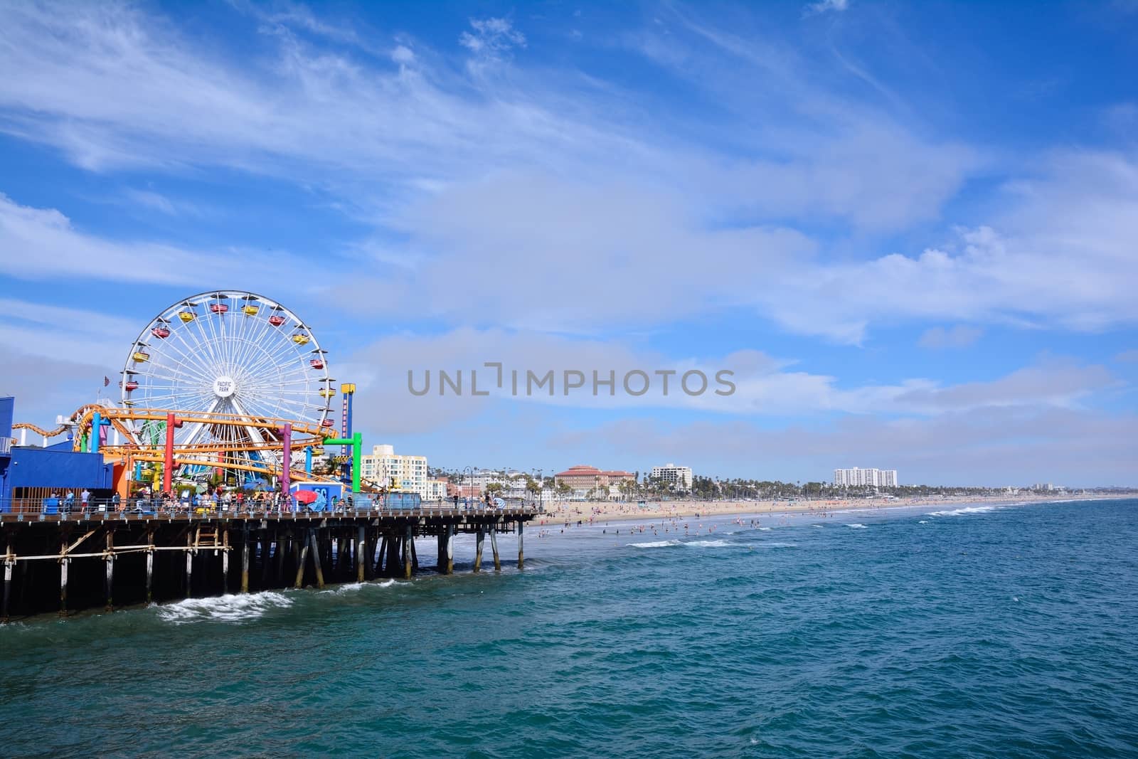 Santa Monica, California - July 27, 2017: Santa Monica Pier in Los Angeles. The pier is a more than hundred-year-old historic landmark that contains Pacific Park, an amusement park.