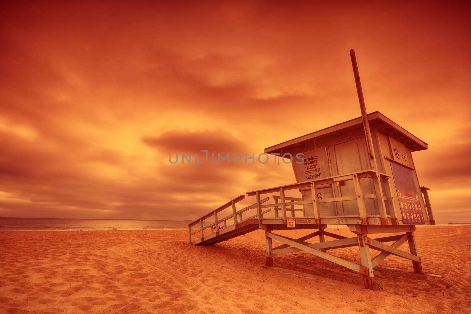 Lifeguard tower with the rosy afterglow of a sunset at Hermosa Beach, California