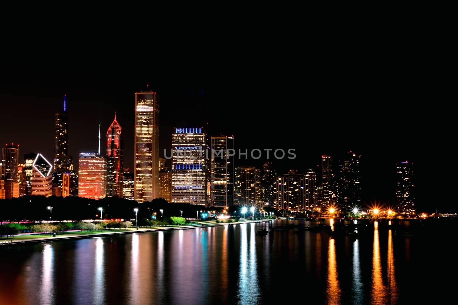 Chicago night skyline across Lake Michigan.