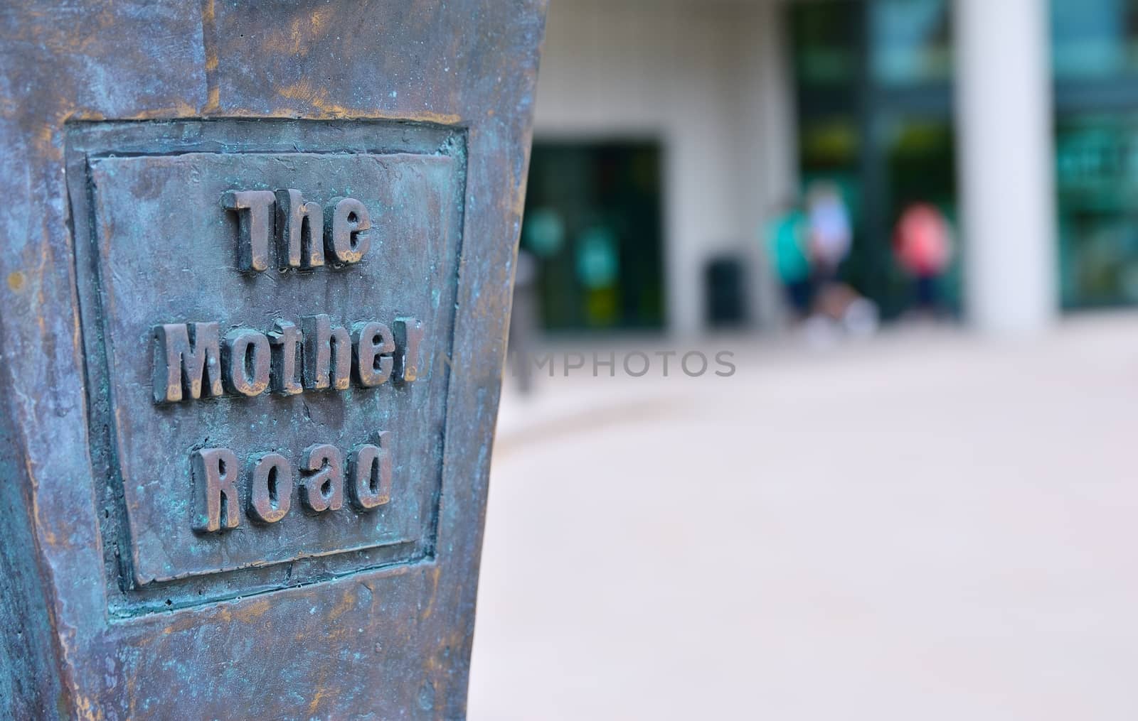 Old route 66 sign in bronze with the phrase, The Mother Road.