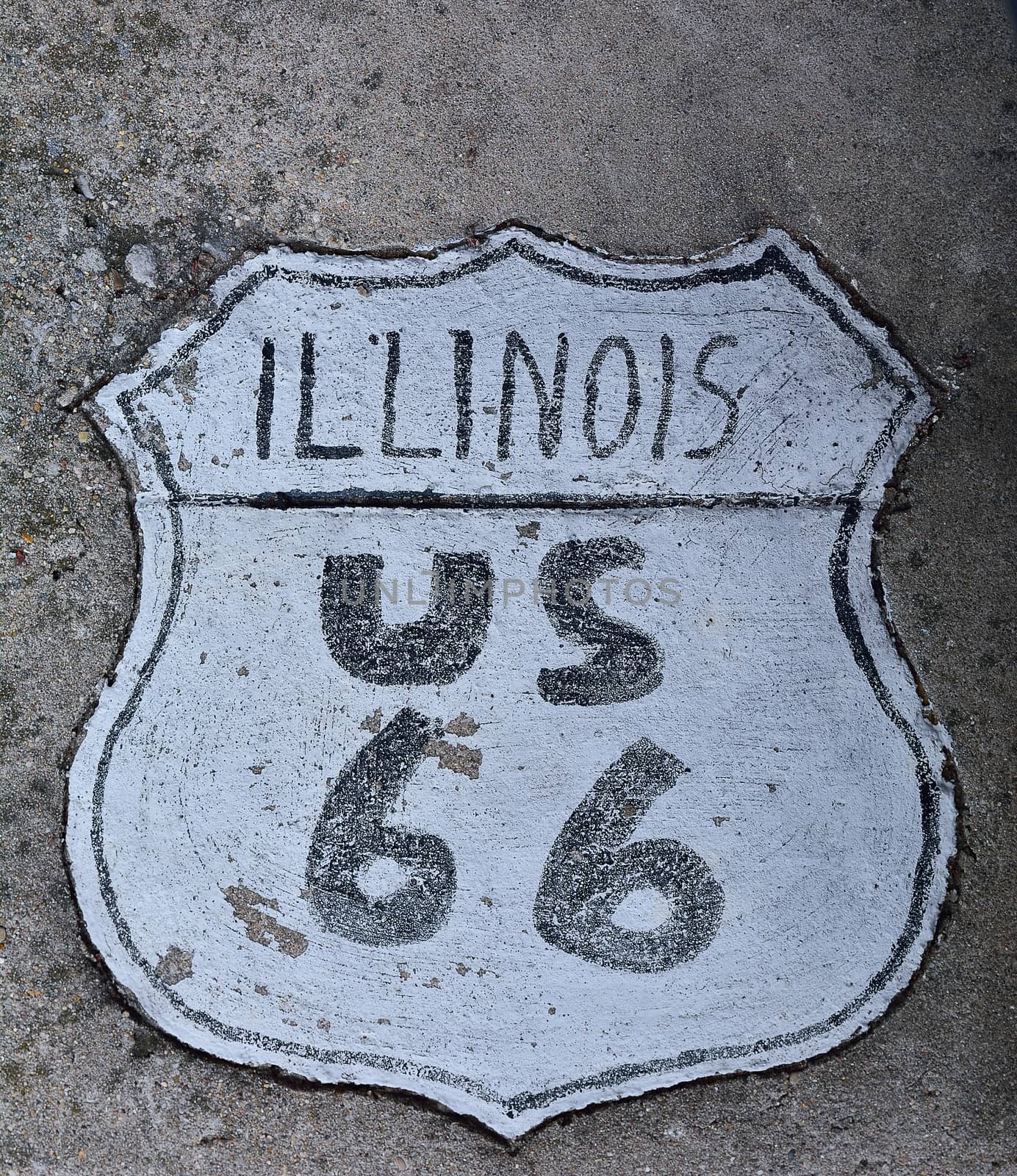 Route 66 sign painted on the road in Illinois.