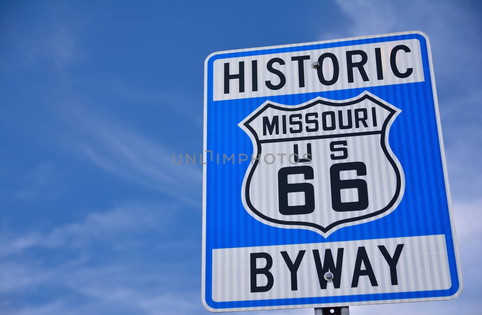 Historic route 66 highway sign in Missouri USA. Blue sky background