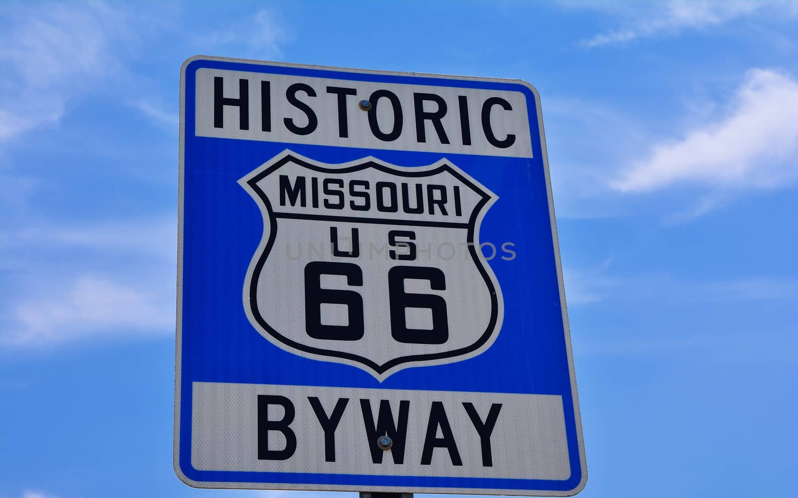 Historic route 66 highway sign in Missouri USA. Blue sky background