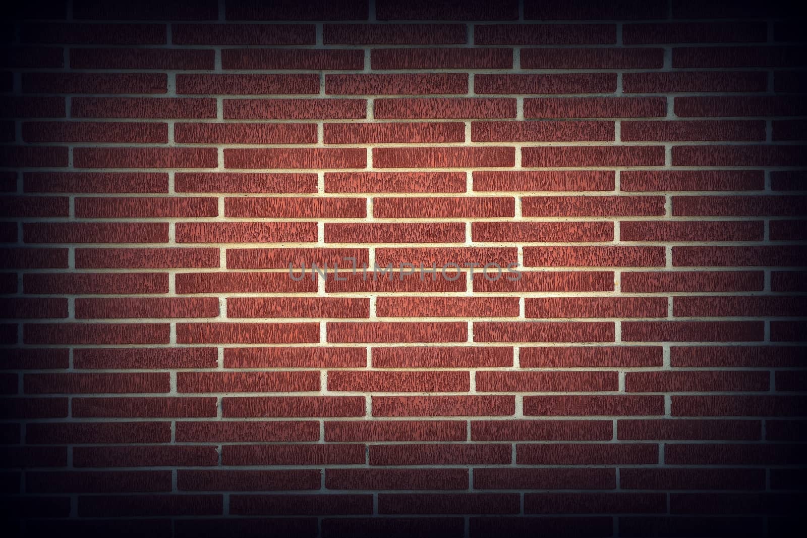 Red brick wall texture background with vignetting corners