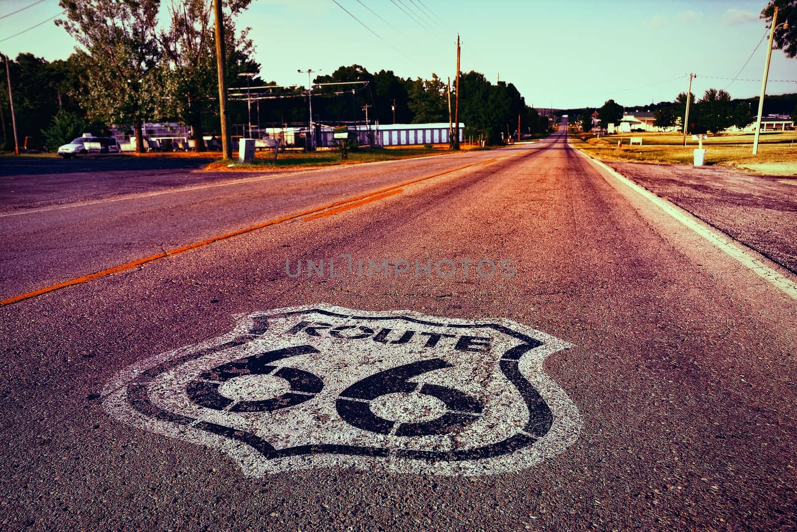 U.S. Route 66 highway, with sign on asphalt on Missouri.