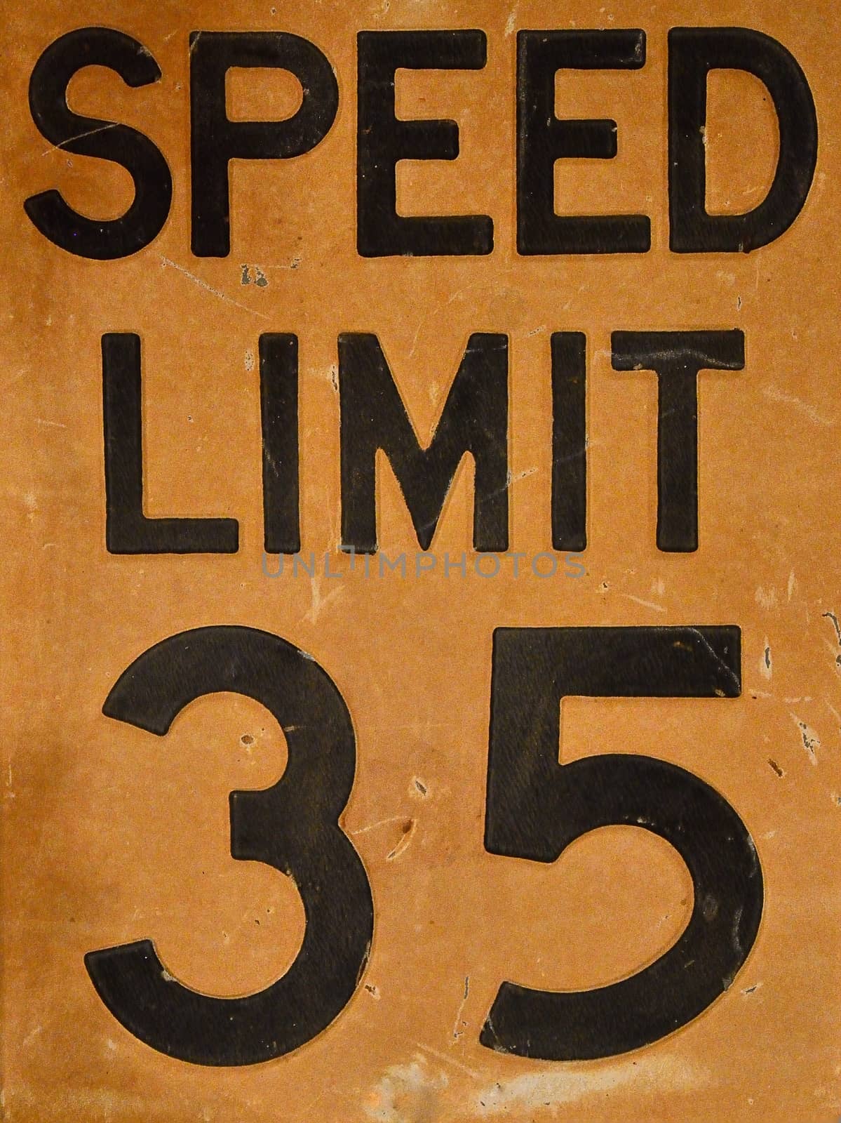 Close up of old speed limit 35 sign.
