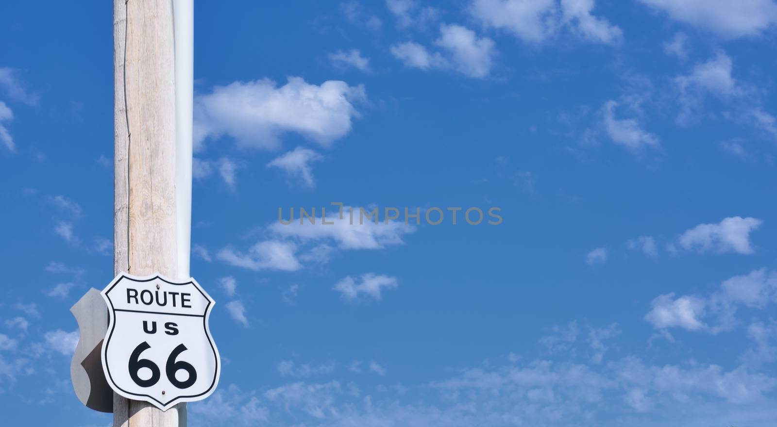 Route 66 sign on blue sky background