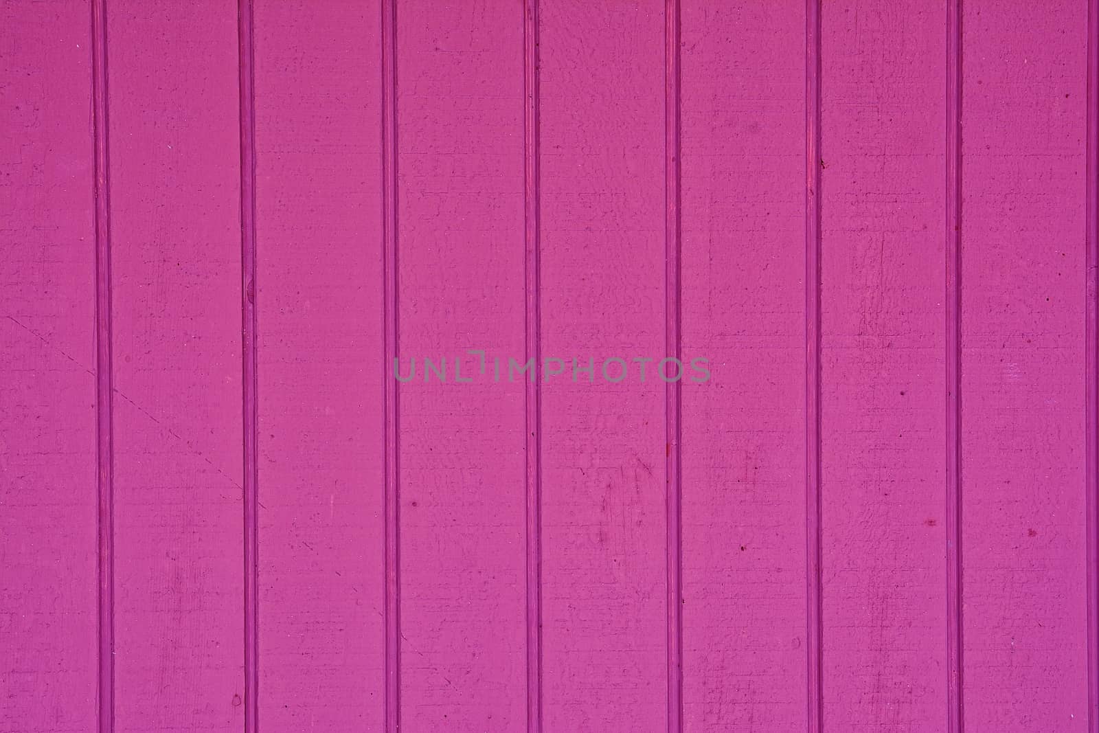 Close-up of vertical wooden planks of pink color