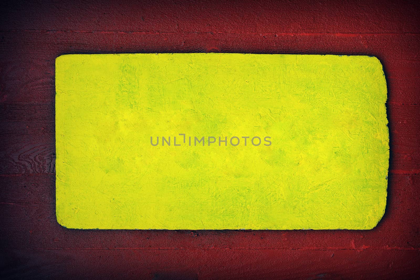 A rustic wooden sign in red and yellow, color copy space.