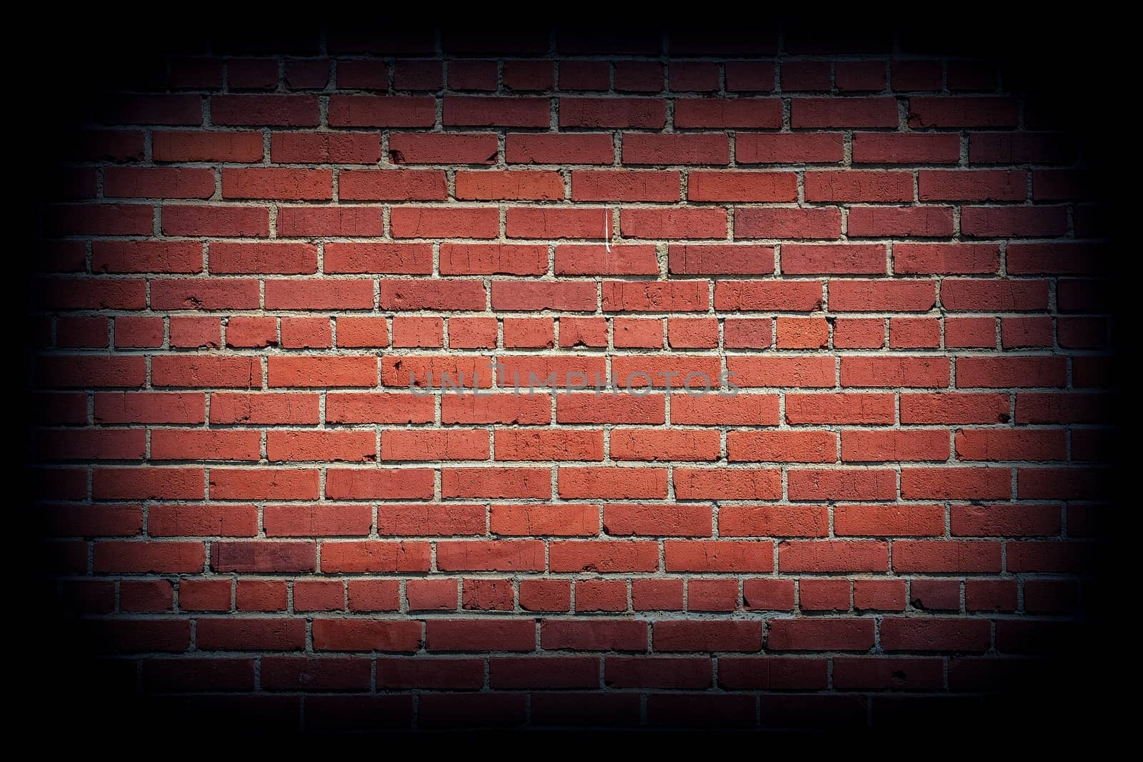 Red brick wall texture background with vignetting corners