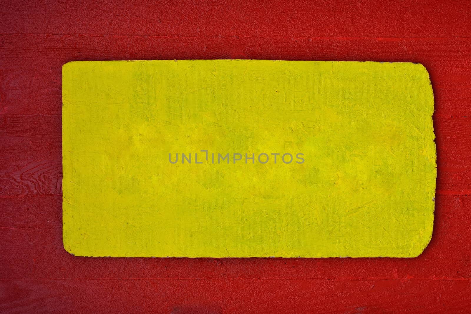 A rustic wooden sign in red and yellow, color copy space.