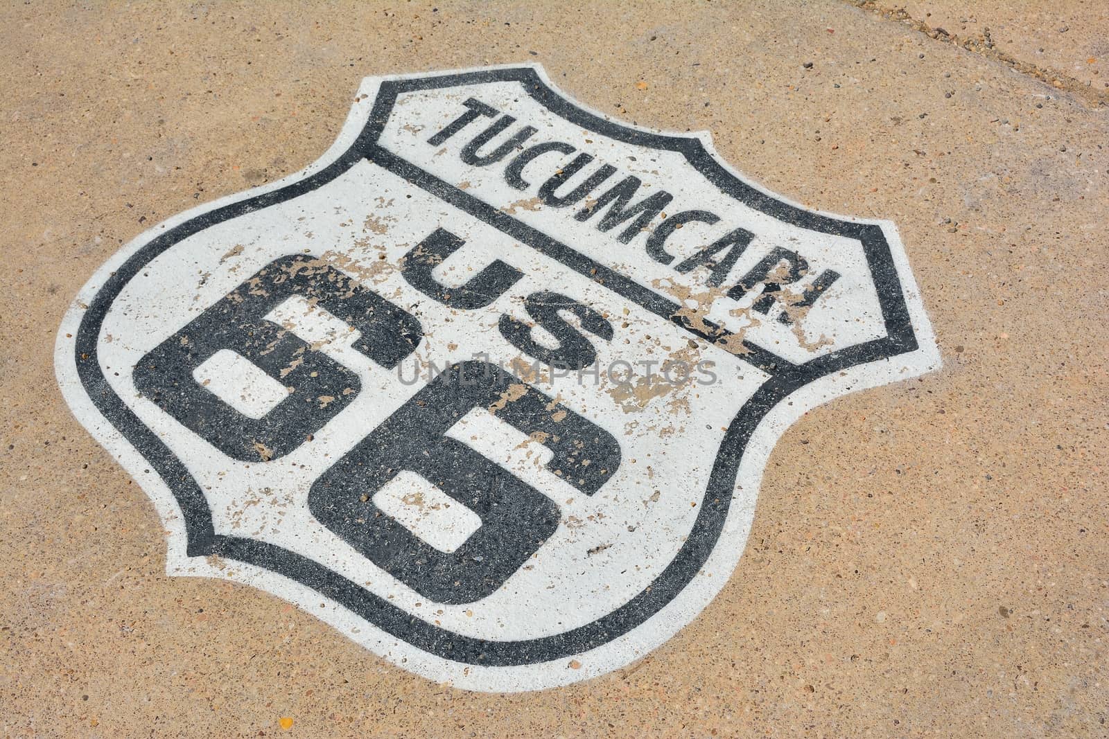 Route 66 sign painted on the road in Tucumcari