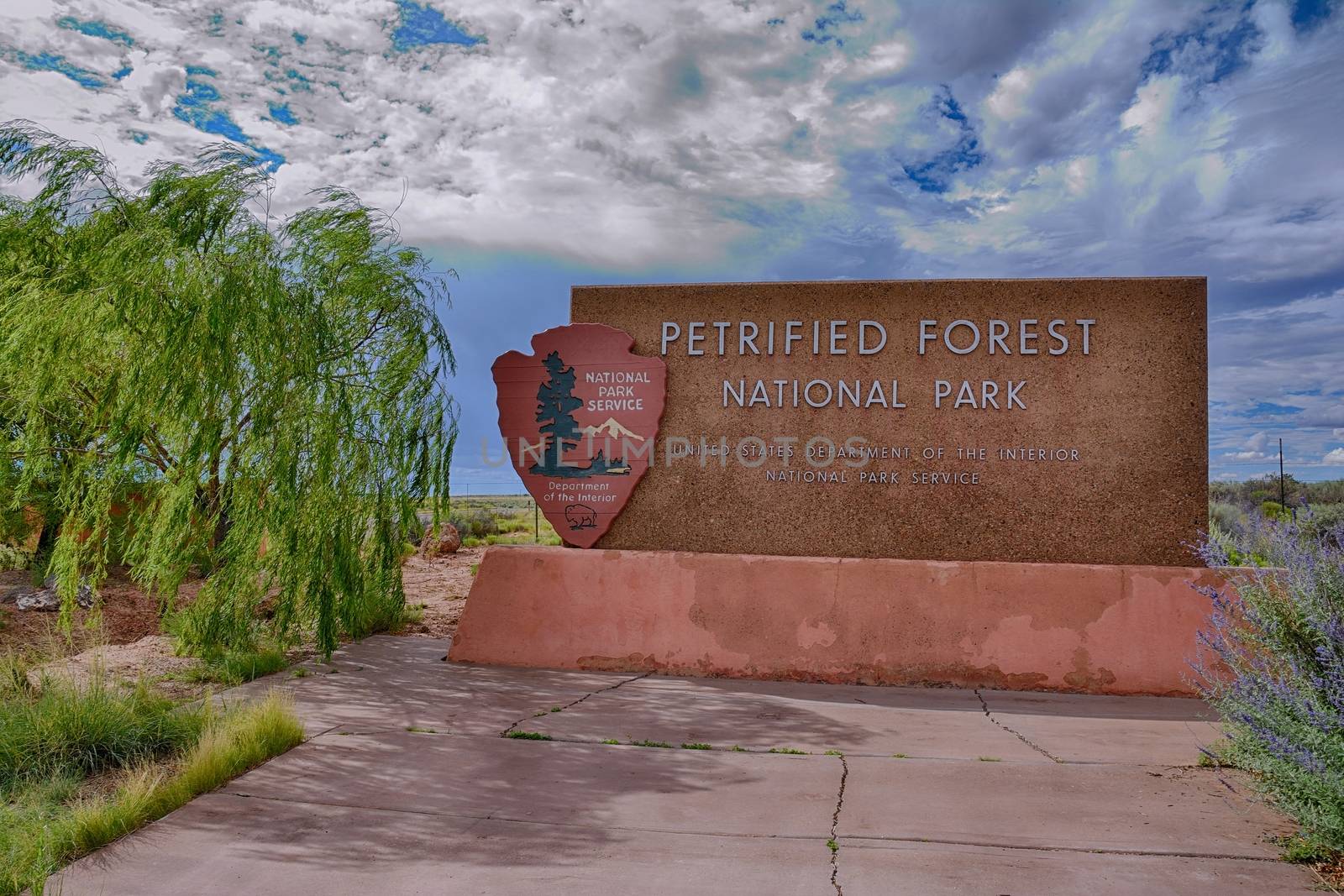 NAVAJO COUNTY, ARIZONA - JULY 22: The entrance sign to the Petrified Forest National Park, a popular tourist destination in Arizona on July 22, 2017 in Petrified Forest, Arizona.