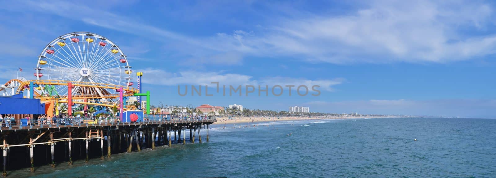 Santa Monica, California - July 27, 2017: Santa Monica Pier in Los Angeles. The pier is a more than hundred-year-old historic landmark that contains Pacific Park, an amusement park.