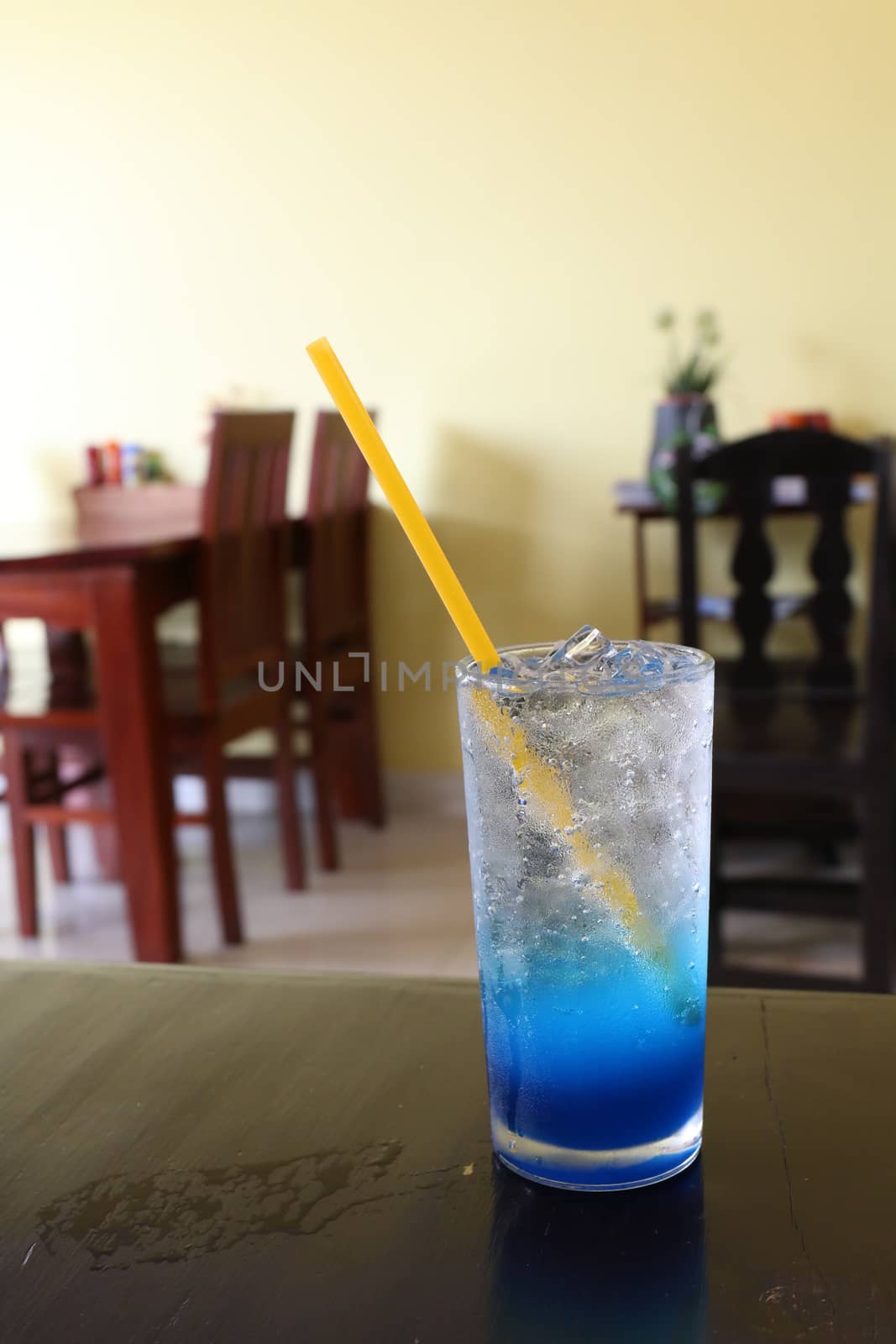Glass cool ice water blue lemon juice on table for drink fresh by cgdeaw