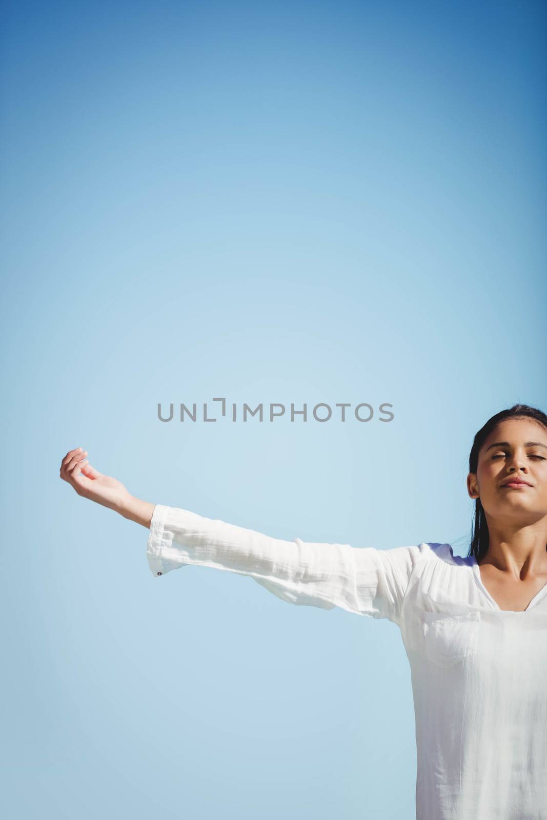 Calm brunette doing yoga by Wavebreakmedia