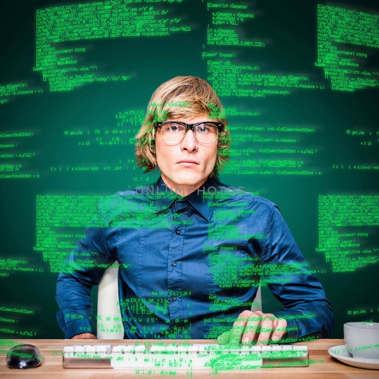 Focused hipster businessman using computer against green background with vignette