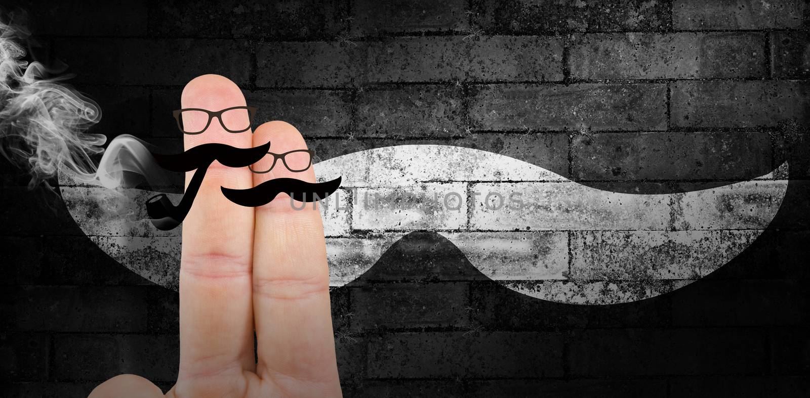 Fingers with mustache against texture of bricks wall