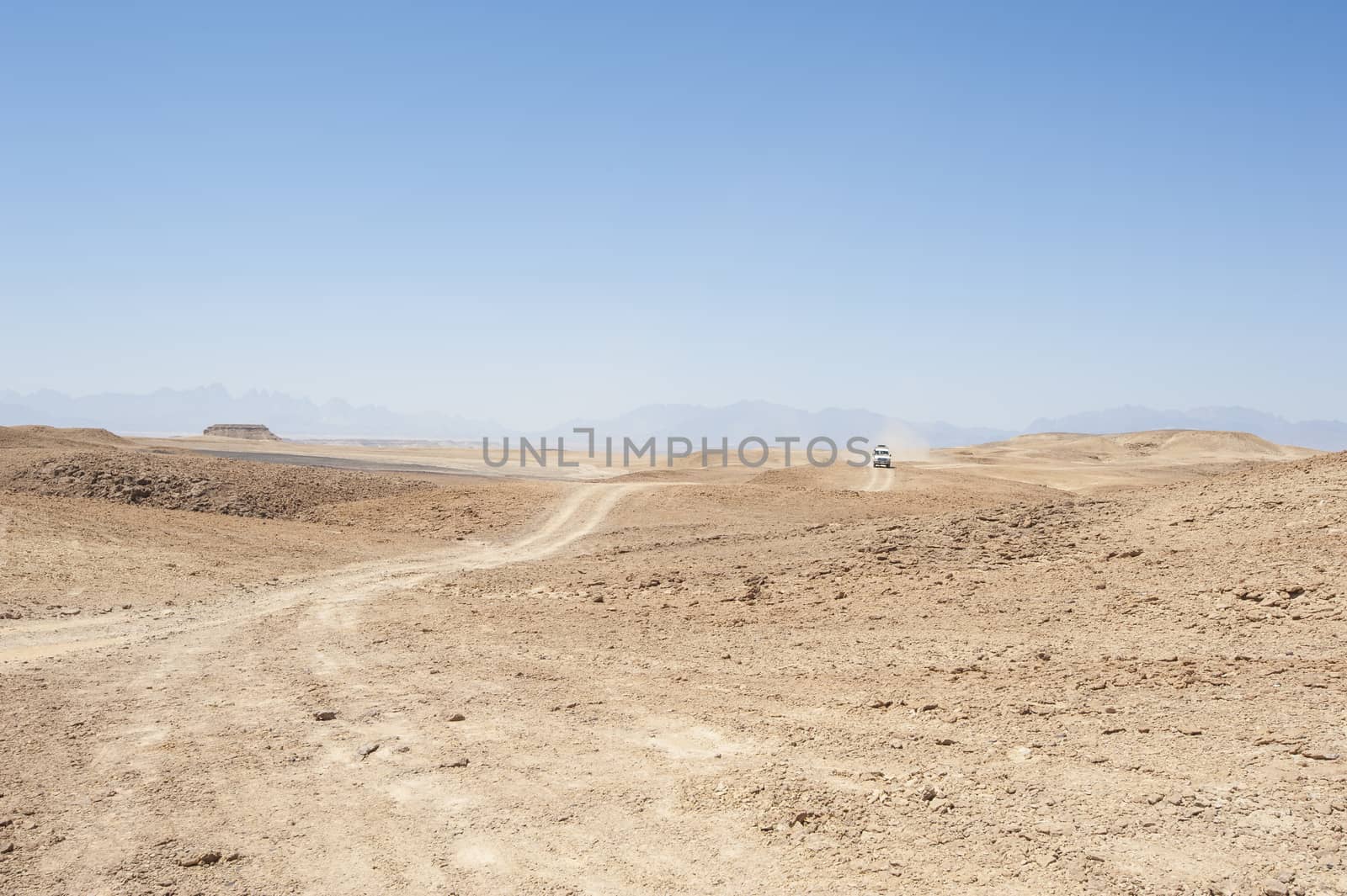 Travel on an empty desert landscape by paulvinten