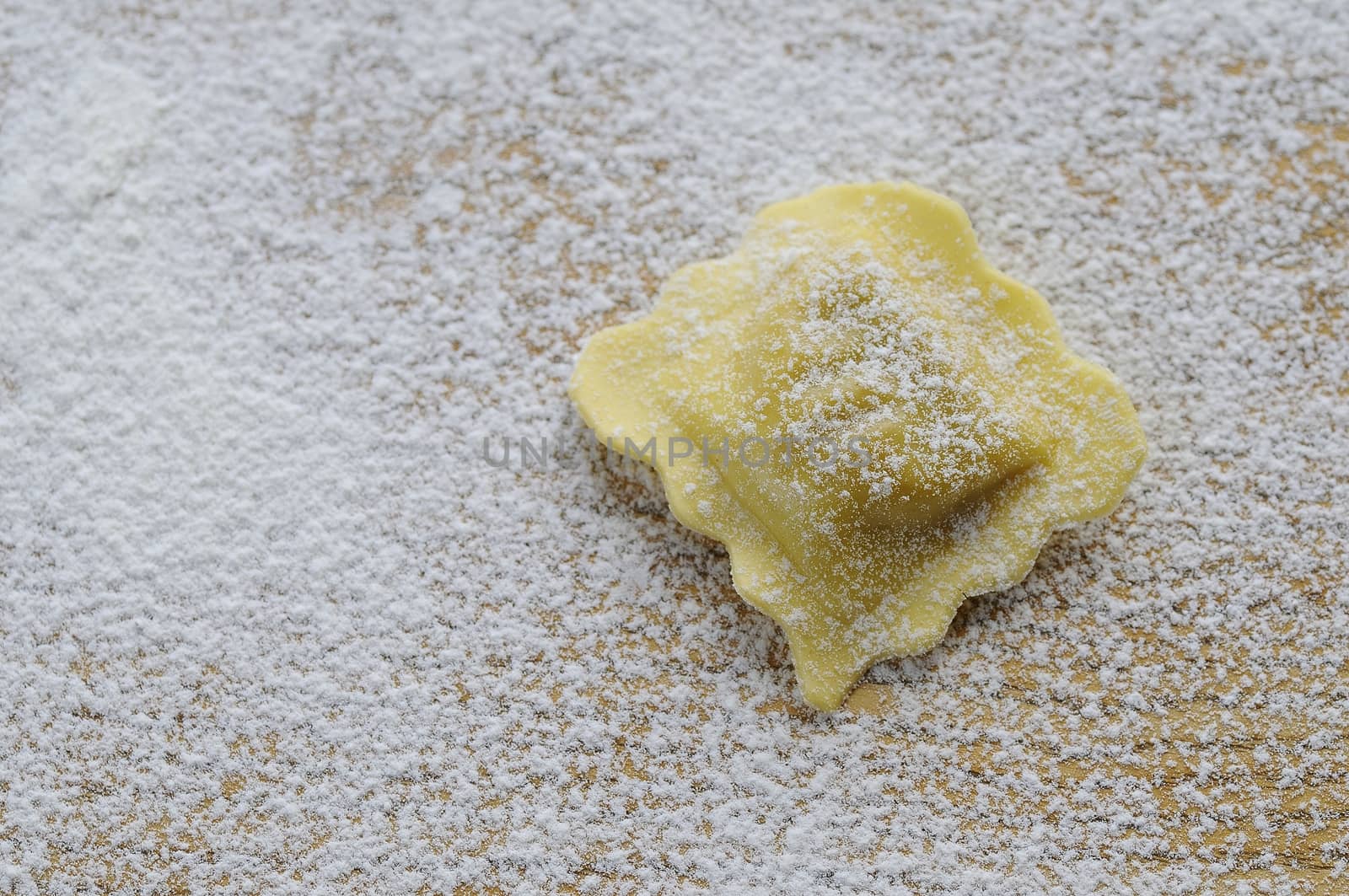 Preparing fresh ravioli at the kitchen table.