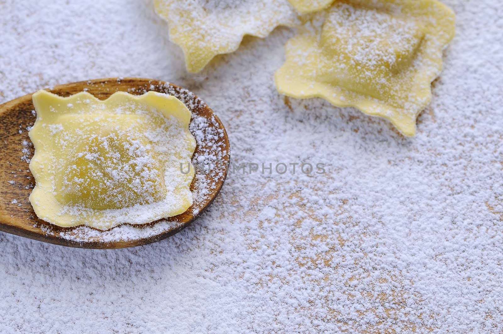 Preparing fresh ravioli at the kitchen table.