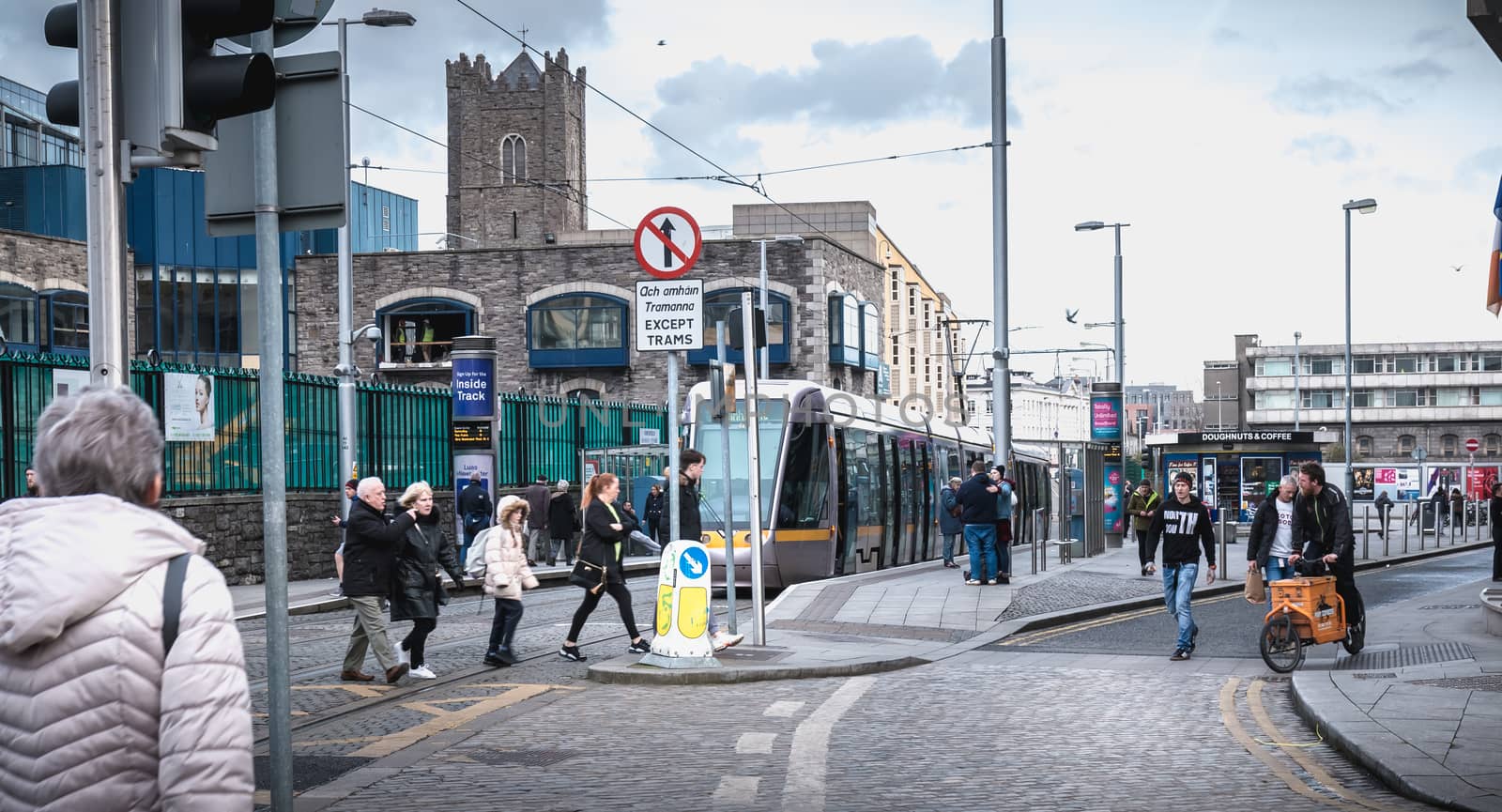 Passengers waiting for an electric tram in Dublin, Ireland by AtlanticEUROSTOXX