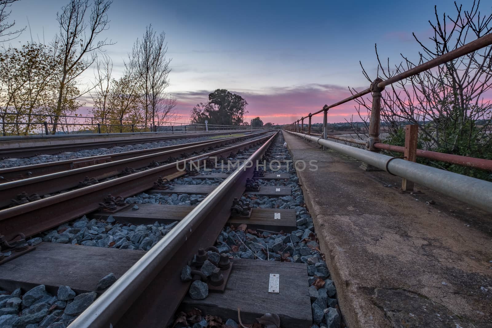 railway crossing sunset