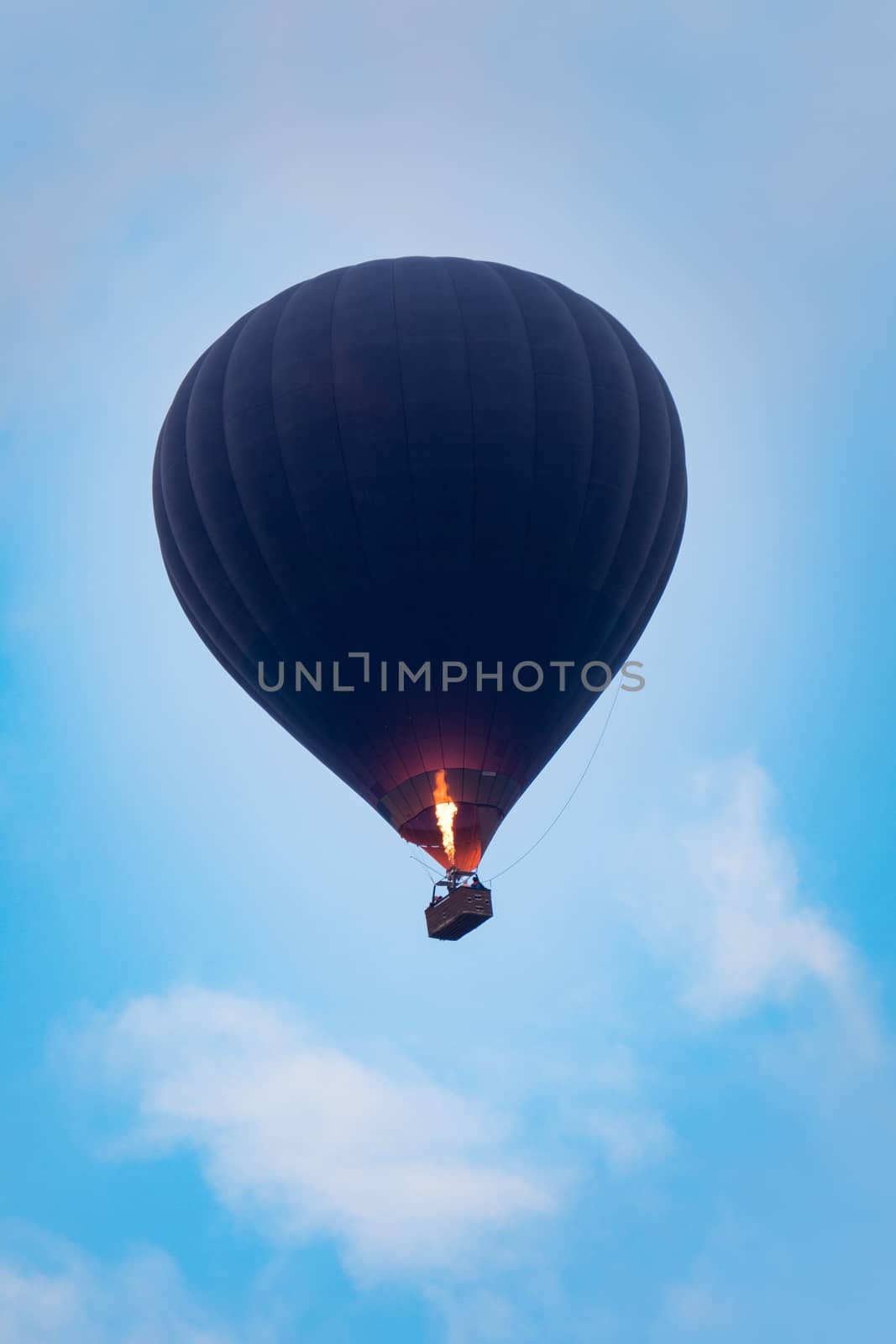 hot air balloon flying over blue sky