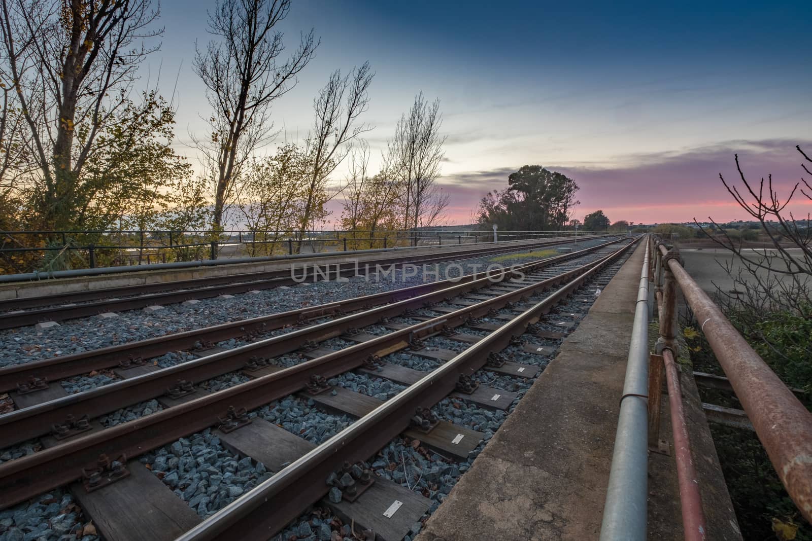 railway crossing sunset
